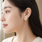 Selunyra Round Cross Earrings worn styling view 1