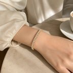 Selunyra gold baguette bracelet worn in daylight