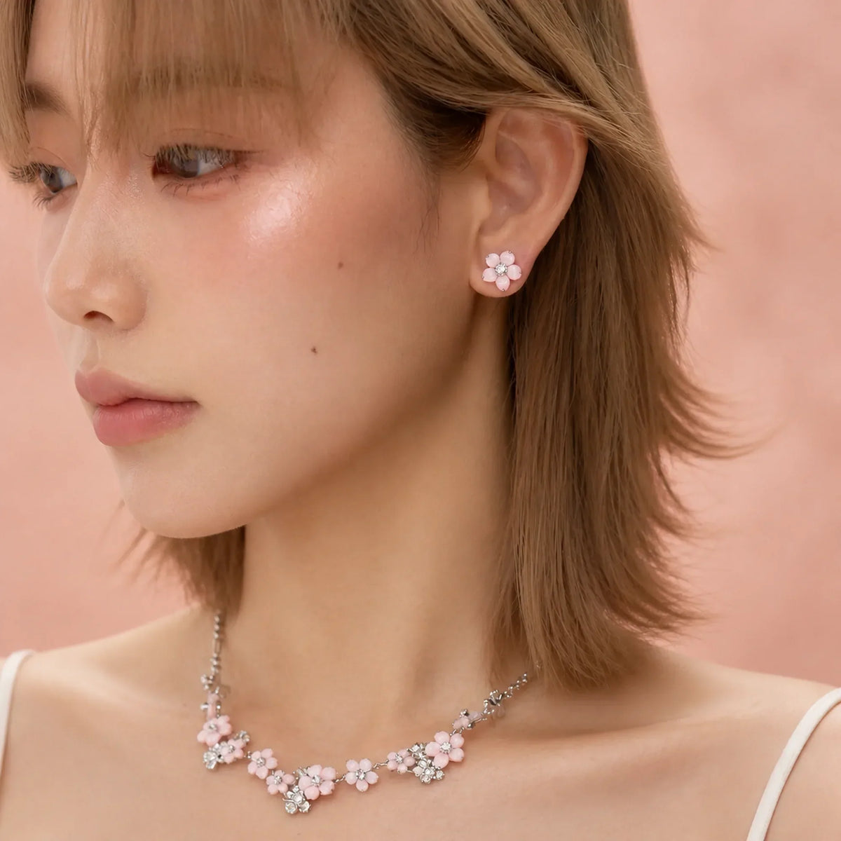 Selunyra Blossom necklace and earrings worn by model