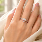 Selunyra Bow Heart Ring worn on hand in warm light