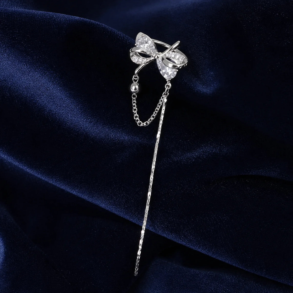 Selunyra silver butterfly bow ear cuff with chain and tassel