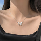 Selunyra Butterfly Necklace B worn with black satin neckline