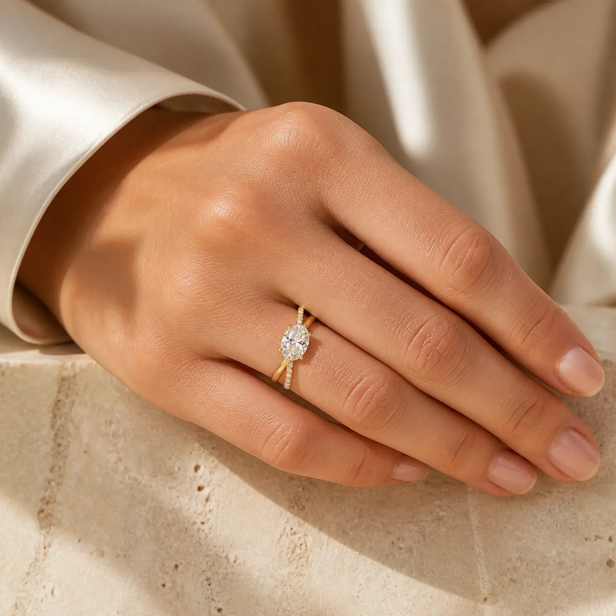 Selunyra gold Chica oval crossover ring worn on hand