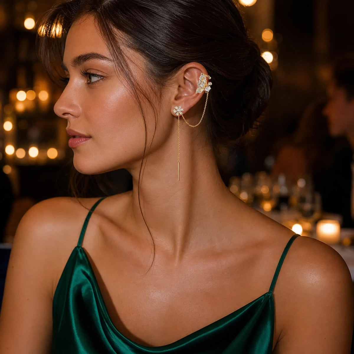 Selunyra butterfly flower chain ear cuff worn for evening