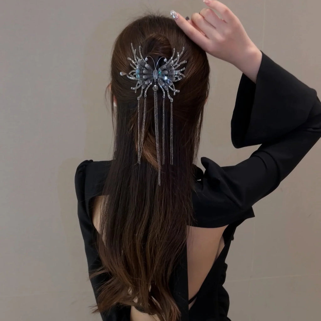 Selunyra dark butterfly tassel hairpin worn with long hair