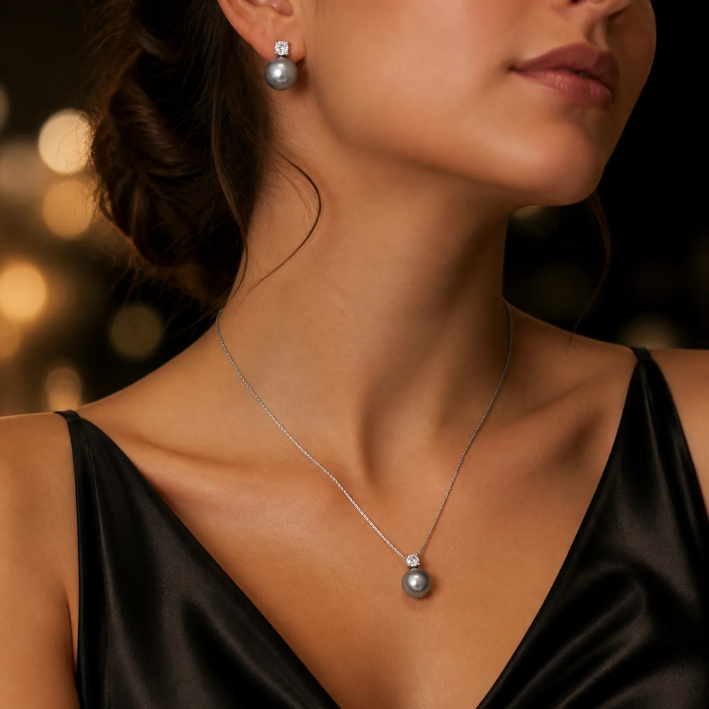 Selunyra Diana graphite pearl necklace and stud earring set worn in evening light
