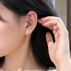Selunyra Elena oval solitaire stud earring worn