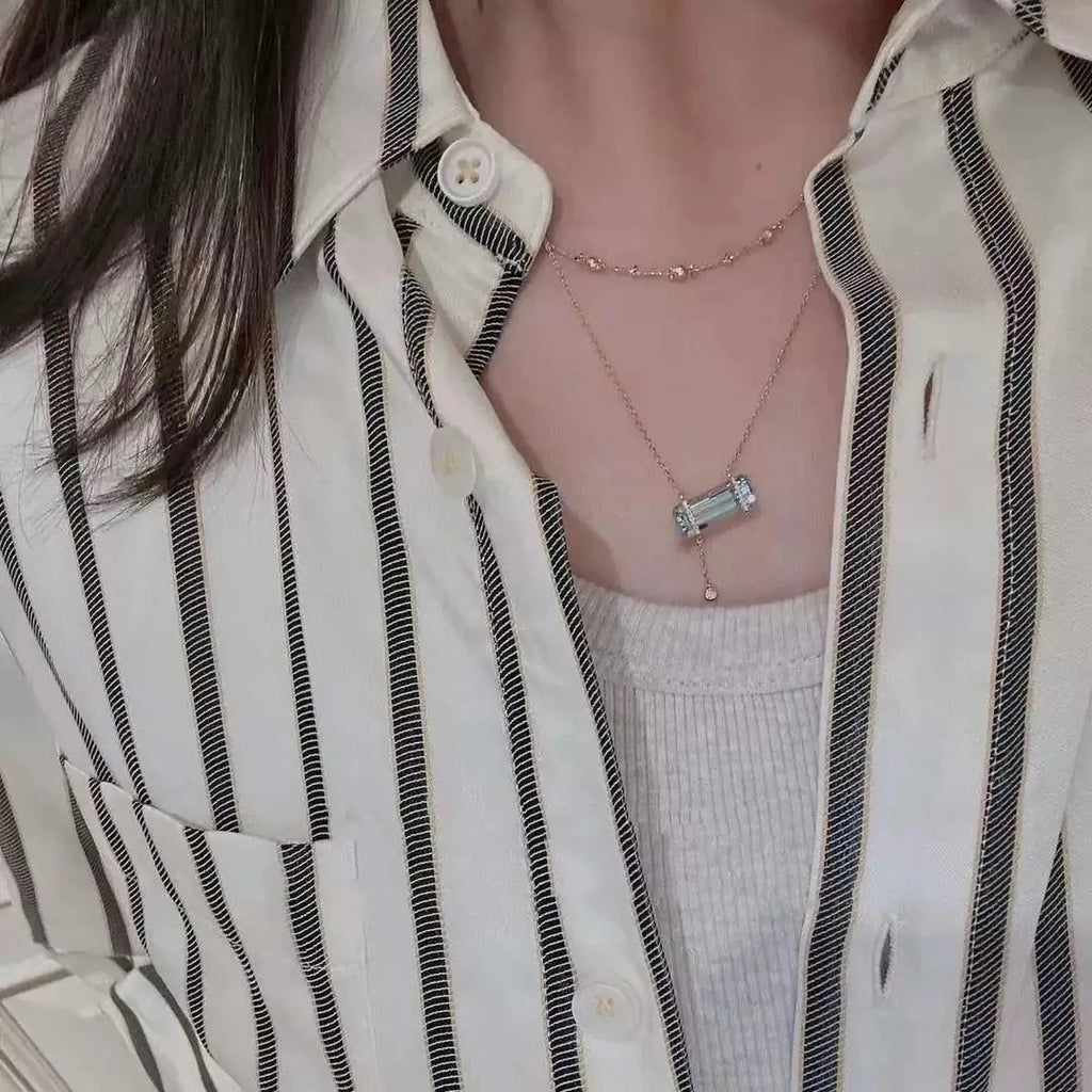 Selunyra Elsa Necklace worn with striped shirt