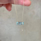 Selunyra Elsa Necklace held in hand, close-up