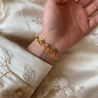 Selunyra Gold Butterfly Bracelet worn with embroidered silk