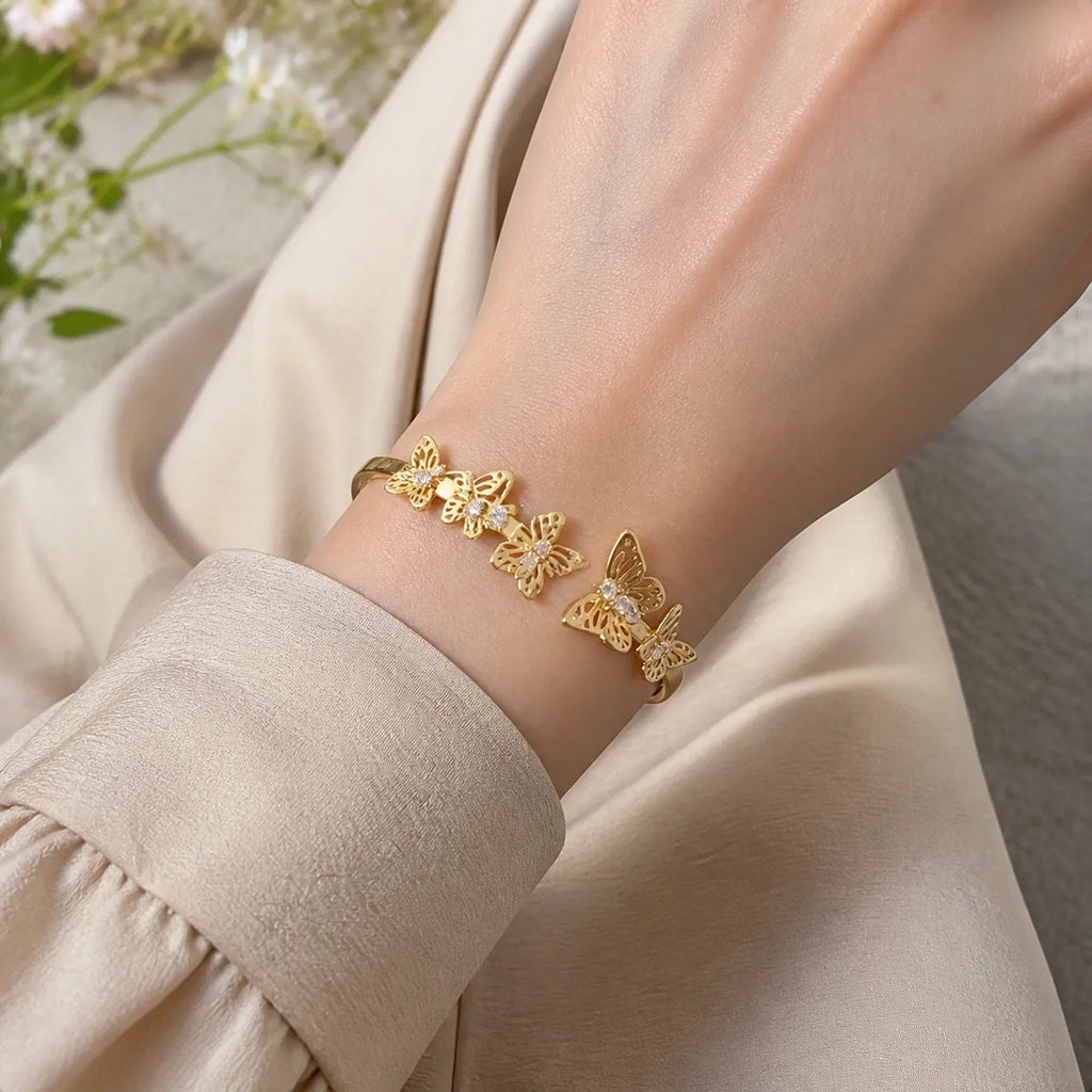 Selunyra Gold Butterfly Bracelet worn in soft daylight