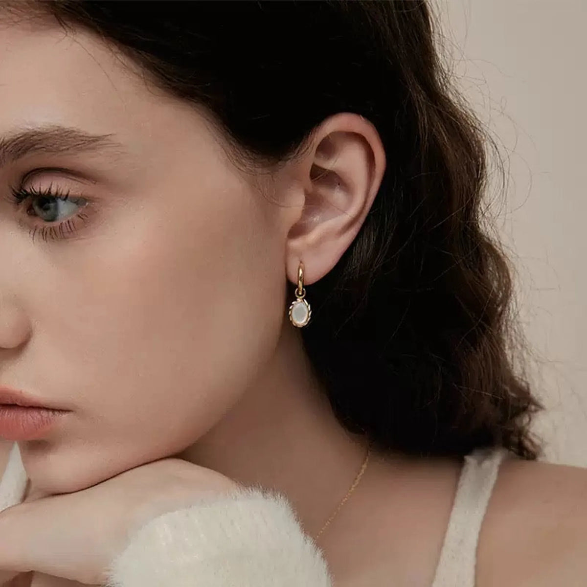 Selunyra Goldier earrings worn close-up