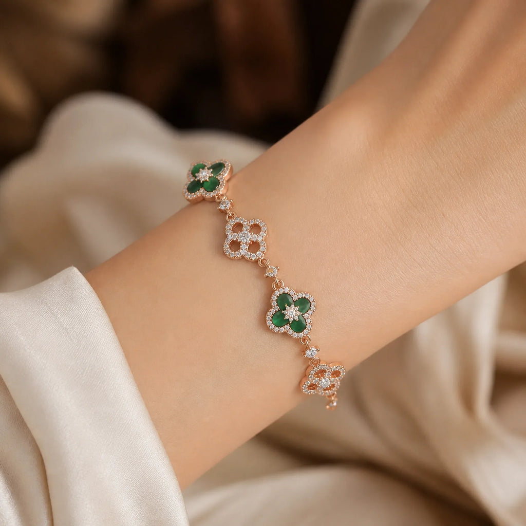 Selunyra Green Cleef gold bracelet worn on wrist