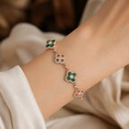 Selunyra Green Cleef gold bracelet worn on wrist