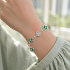 Selunyra Green Cleef silver bracelet worn on wrist