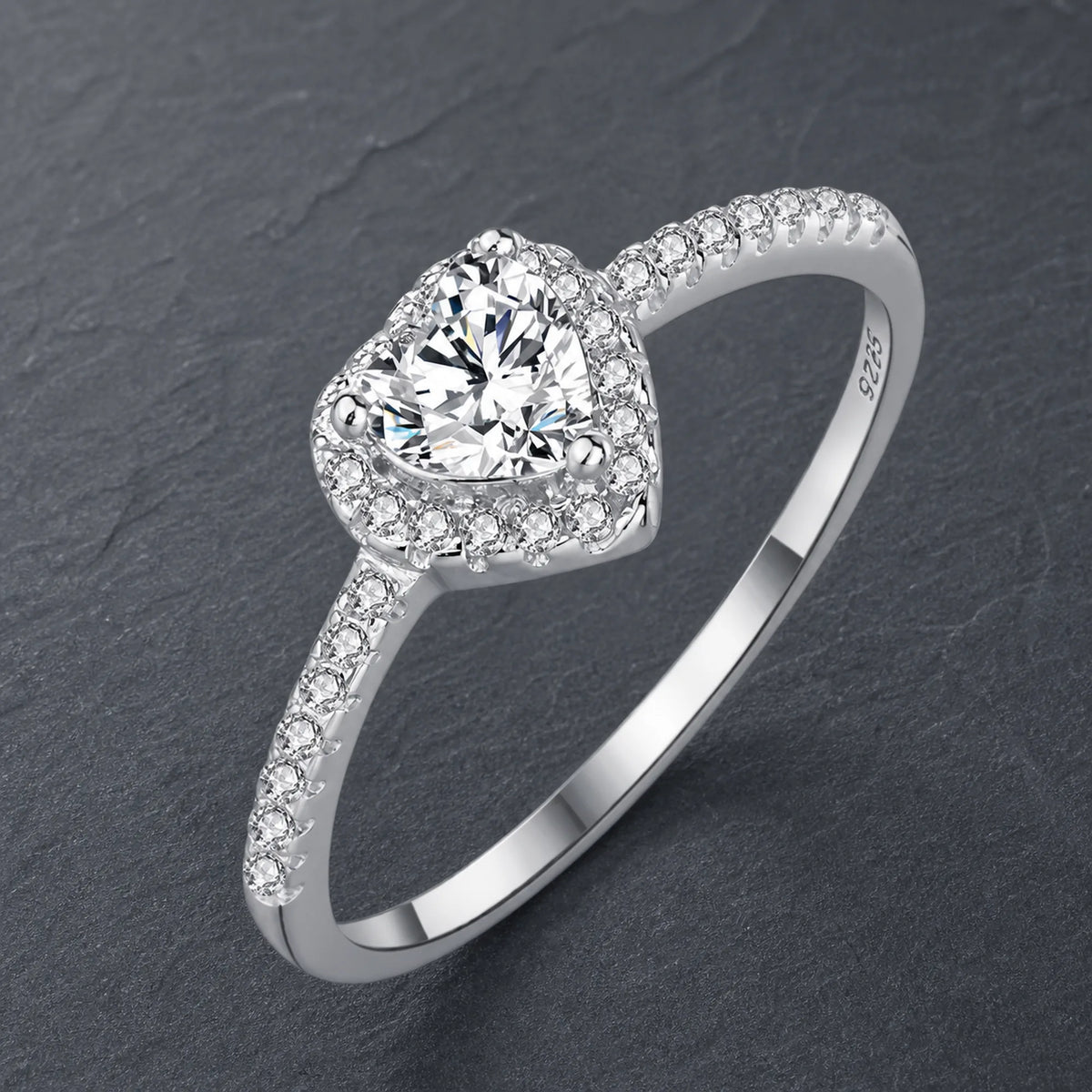 Selunyra silver heart halo ring on charcoal slate