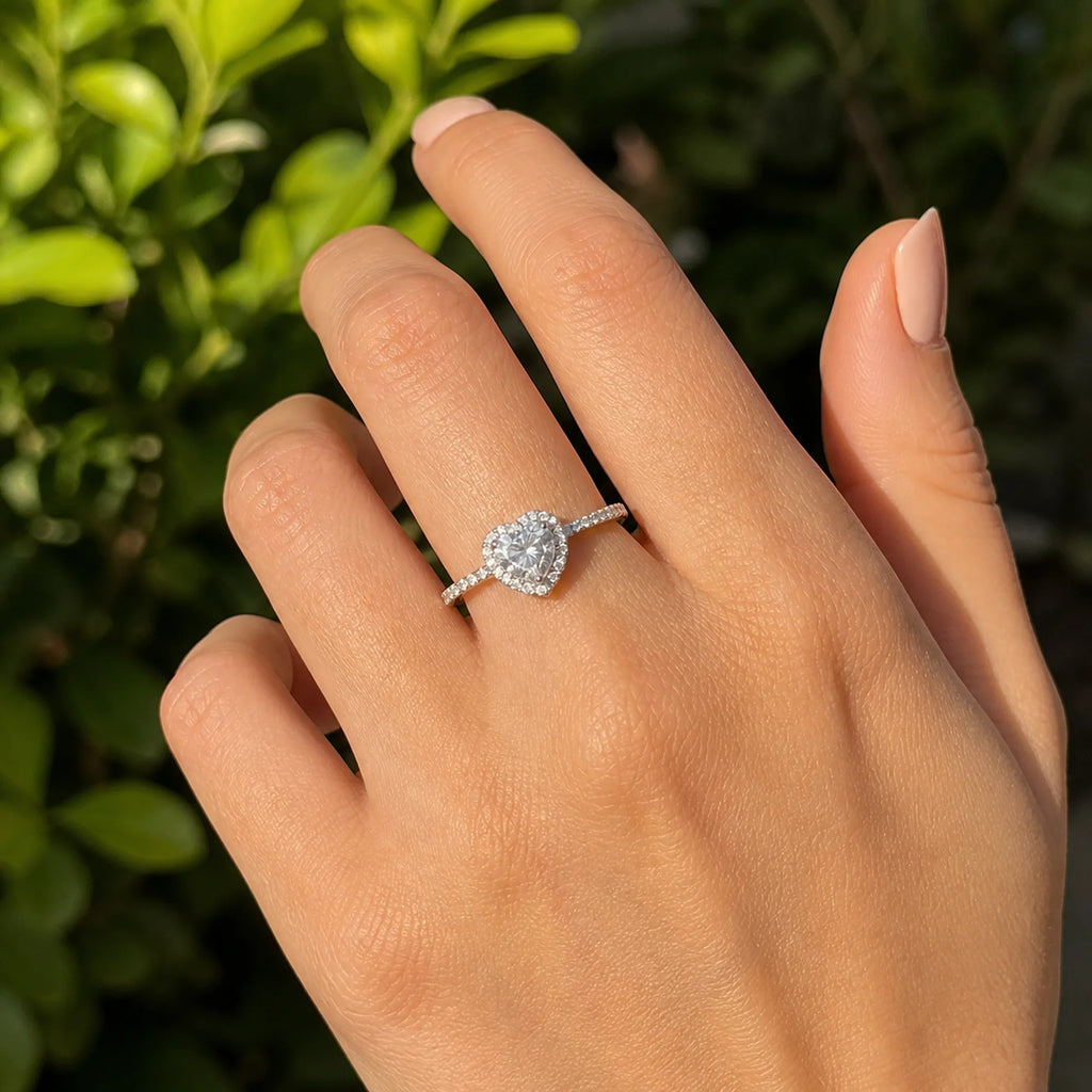 Selunyra silver heart halo ring worn outdoors
