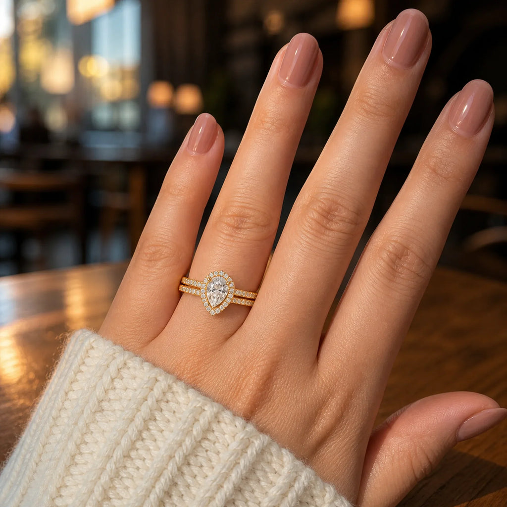 Selunyra gold Miaa pear two-ring set worn on hand