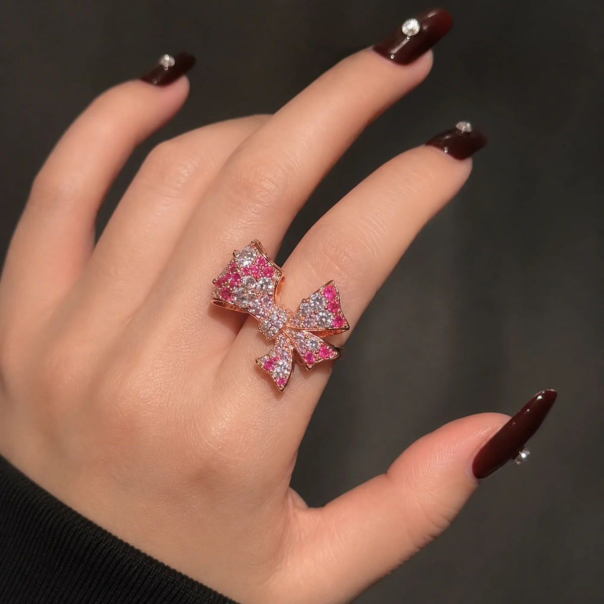 Selunyra Pink Bow Ring worn on hand 2