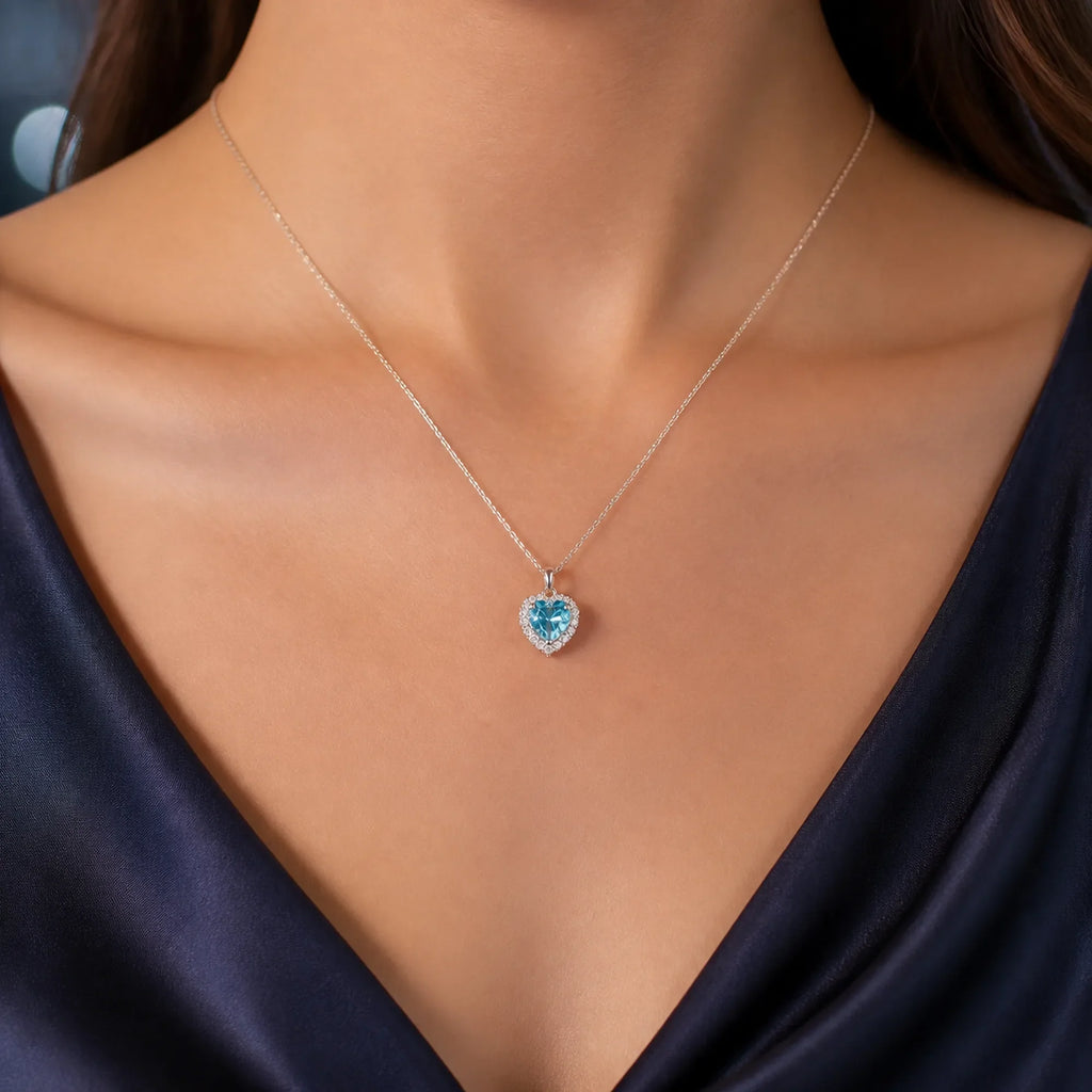 Selunyra Pinko aqua-blue heart halo necklace worn for evening