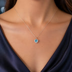 Selunyra Pinko aqua-blue heart halo necklace worn for evening