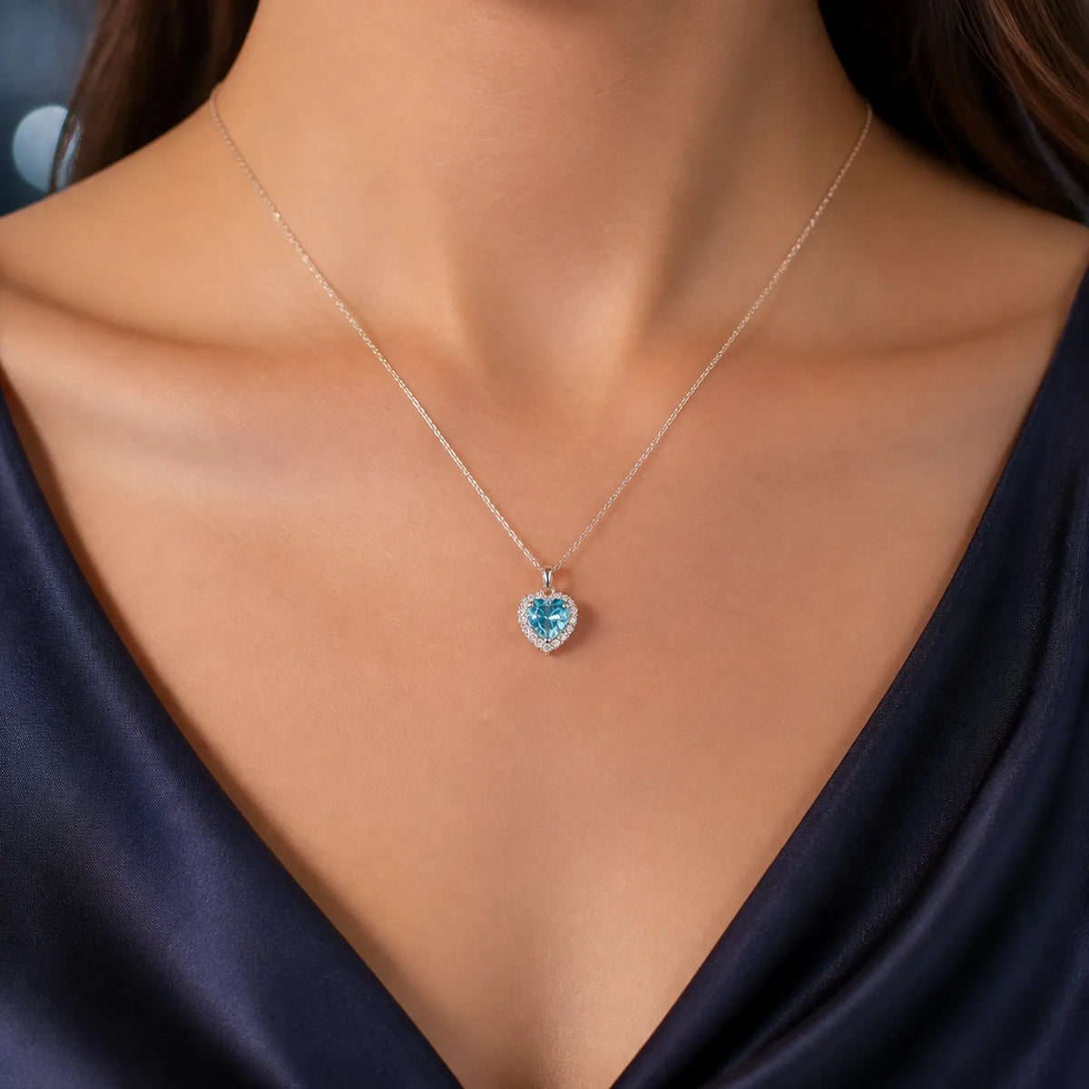 Selunyra Pinko aqua-blue heart halo necklace worn for evening