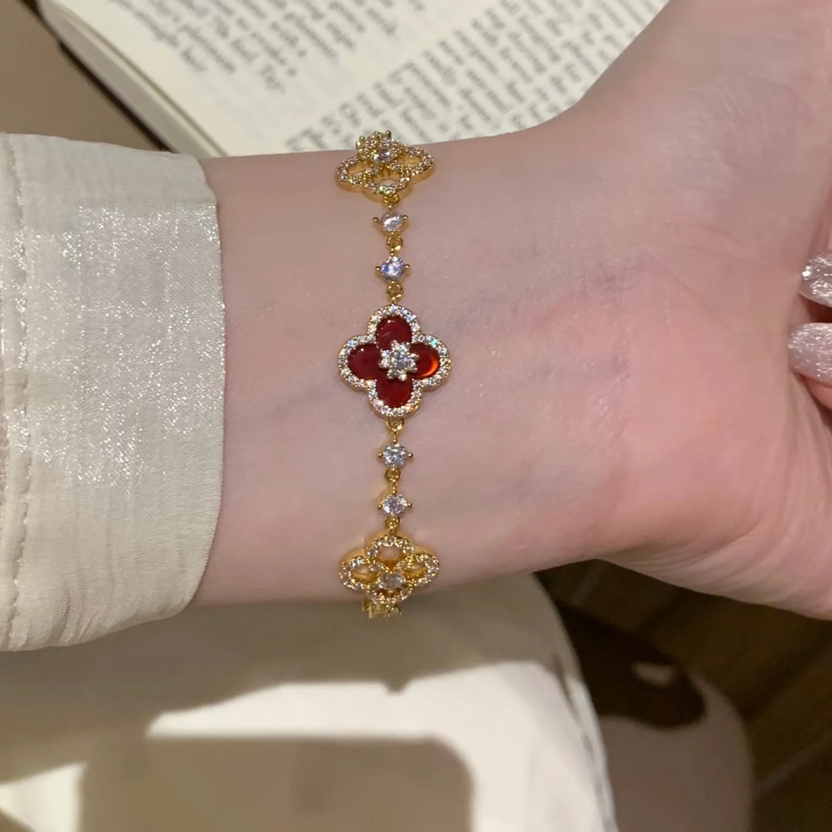 Selunyra Red Cleef Bracelet worn on wrist 2