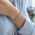 Selunyra Royal Blue Cleef silver bracelet worn on wrist