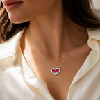 Selunyra ruby heart necklace worn with ivory blouse