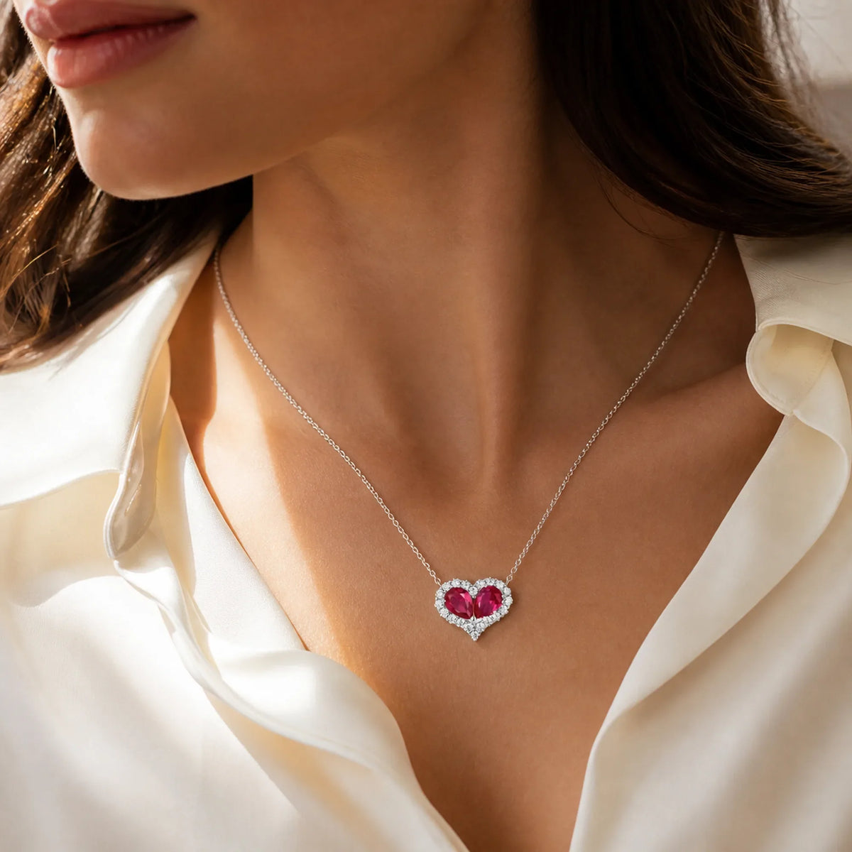 Selunyra ruby heart necklace worn with ivory blouse