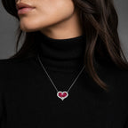 Selunyra ruby heart necklace worn over black knit