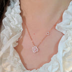 Selunyra Sakura Cleef pink necklace worn with white blouse
