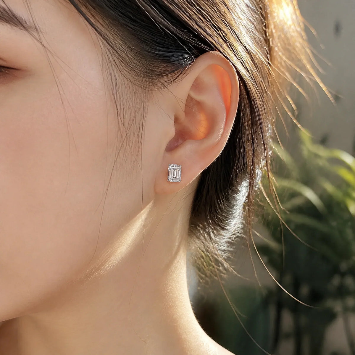 Selunyra Salia emerald-cut stud earring worn in daylight