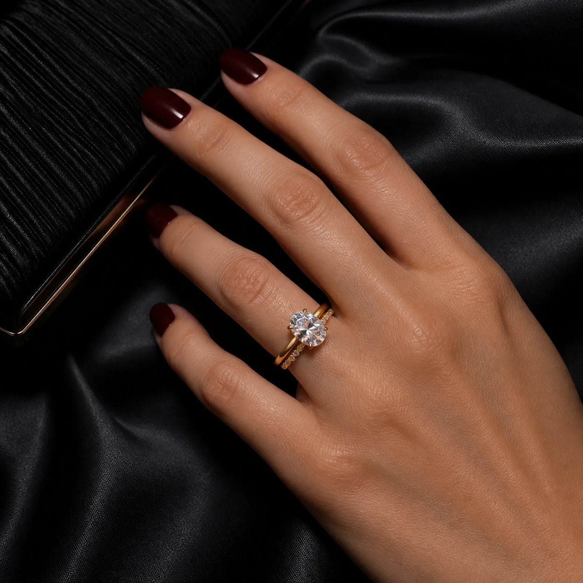 Selunyra Sara oval solitaire and curved band worn in evening style