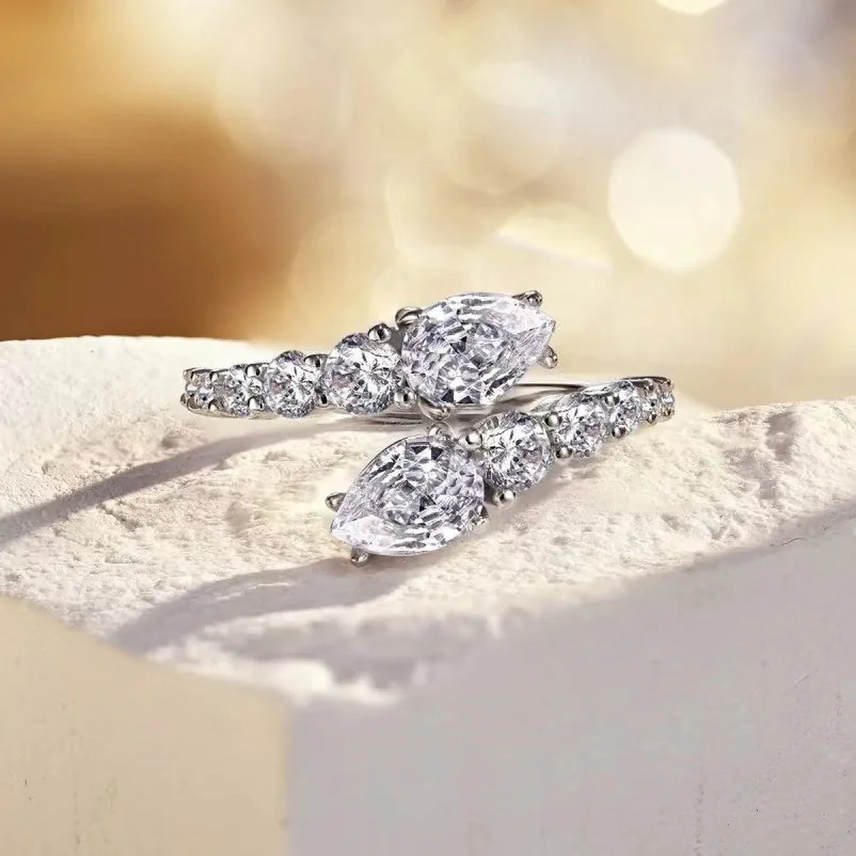 Selunyra Snack open bypass ring with pear-shaped stones