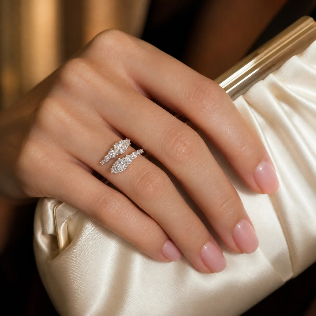 Selunyra Snack ring worn with an ivory silk clutch