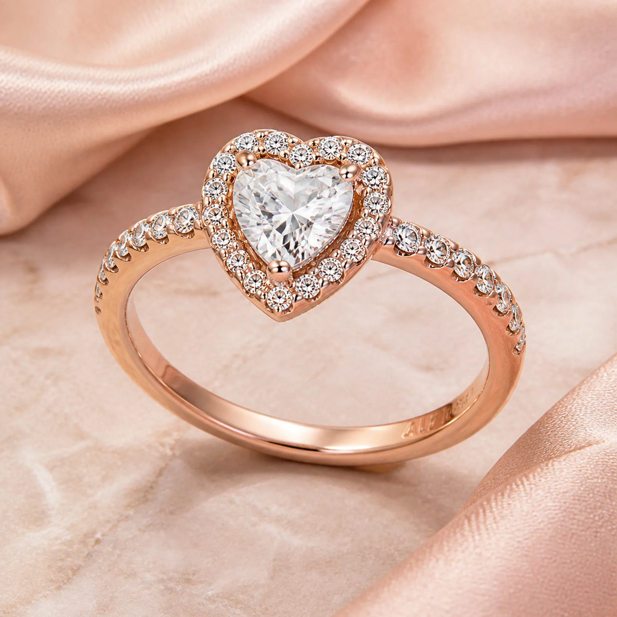 Selunyra rose gold sparkling heart ring on blush satin