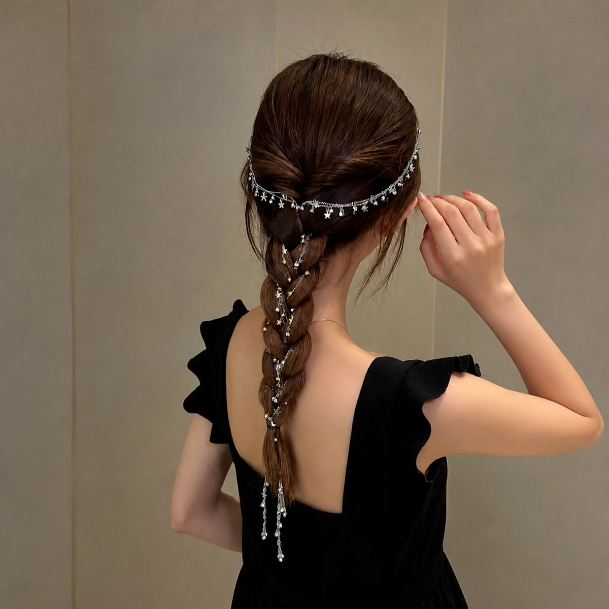 Selunyra star and crystal tassel headdress styled through a braid
