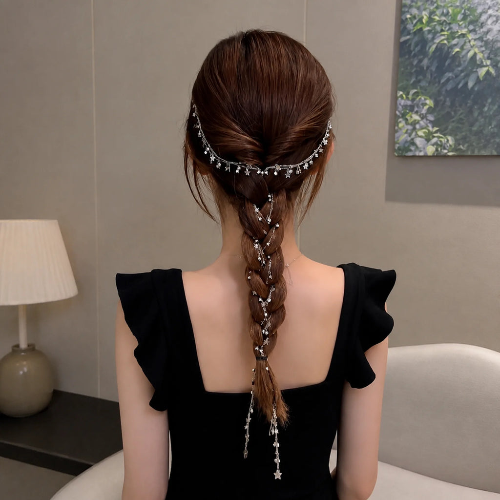 Selunyra tassel headdress in a centered braided hairstyle