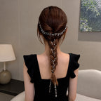 Selunyra tassel headdress in a centered braided hairstyle
