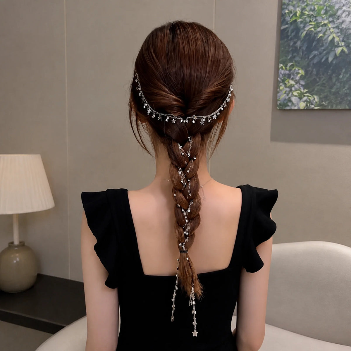 Selunyra tassel headdress in a centered braided hairstyle