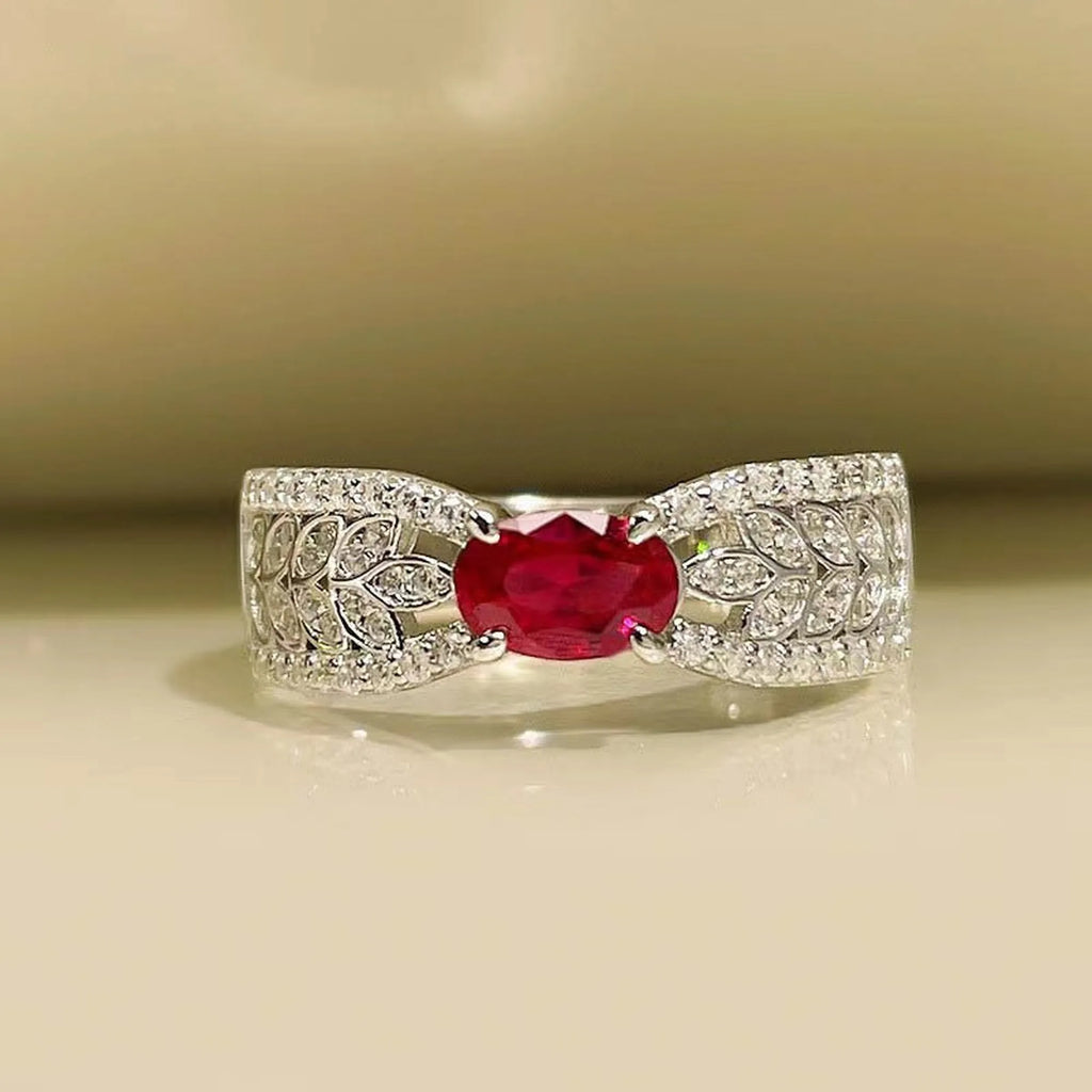 Selunyra Zeus Ring with oval ruby-red stone and leaf motif