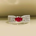 Selunyra Zeus Ring with oval ruby-red stone and leaf motif
